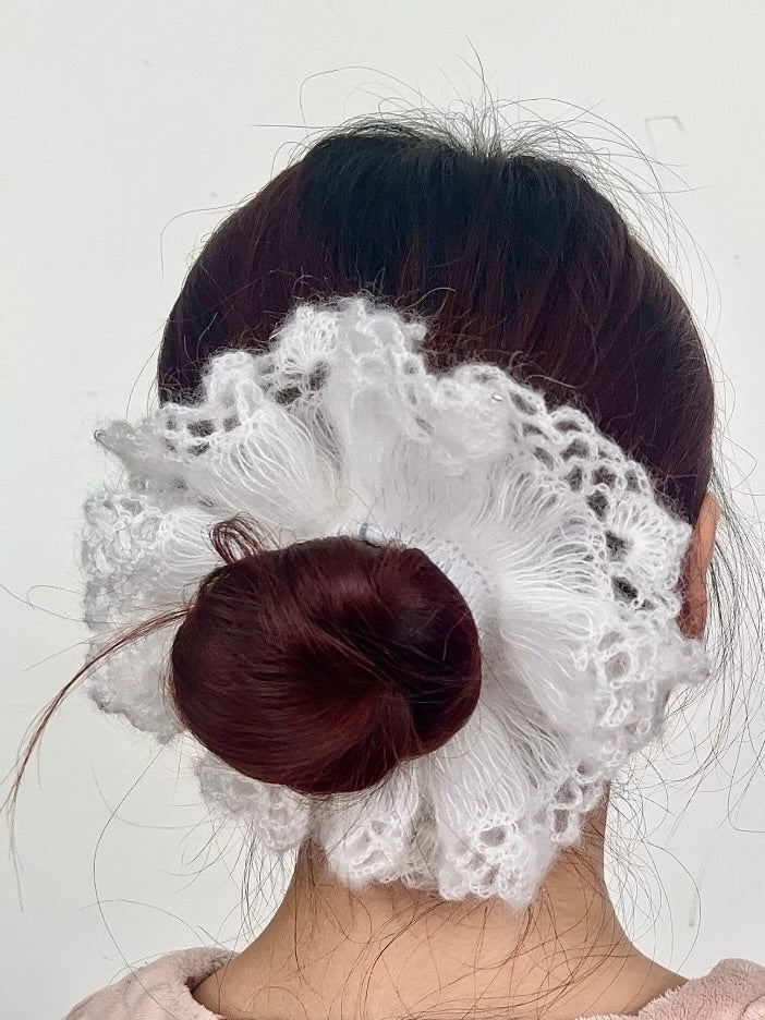 White knitted hair scrunchie worn in hair