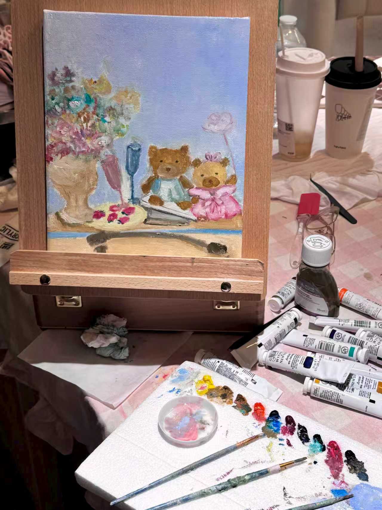 Painting workshop canvas on an easel with art supplies